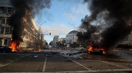 Cars burn after Russian military strike, as Russia's invasion of Ukraine continues, in central Kyiv, ...