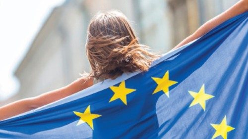 EU Flag. Cute happy girl with the flag of the European Union. Young teenage girl waving with the ...