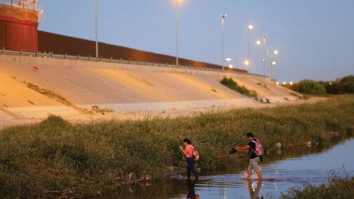 Asylum-seeking migrants from Venezuela cross the Rio Bravo river to turn themselves in to U.S. ...