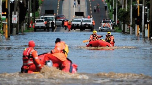TOPSHOT - Emergency workers patrol a flooded area as they evacuate residents in the Maribyrnong ...