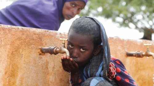 FILE PHOTO: Somali displaced girl Sadia Ali, 8, drinks water from a tap at the Kaxareey camp for ... FILE PHOTO: Somali displaced girl Sadia Ali, 8, drinks water from a tap at the Kaxareey camp for ...