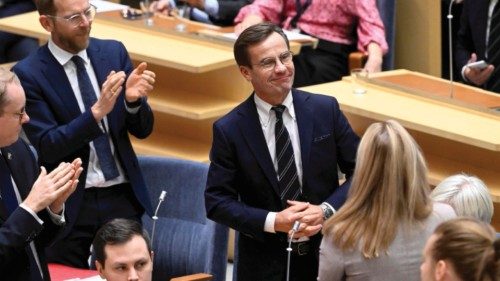 epa10248618 Sweden's Moderate Party leader Ulf Kristersson (C) reacts after being elected as new ...