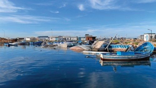 Piles of captured migrant boats are seen at the port of the central Tunisian city of Sfax, on ... Piles of captured migrant boats are seen at the port of the central Tunisian city of Sfax, on ...