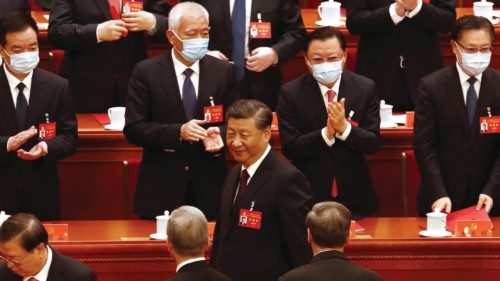 epa10258171 Chinese President Xi Jinping (C) walks past delegates during the closing ceremony of the ...