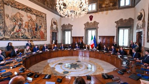 Italy's new Prime Minister, Giorgia Meloni (Rear C) rings the bell as she presides over her ...
