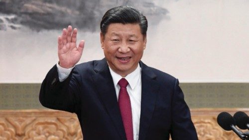 (FILES) In this file photo taken on October 24, 2017, China's President Xi Jinping raises his hand ...