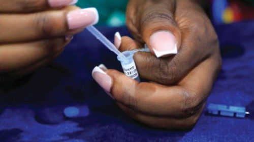 epa10257693 A woman draws diluents from a test tube as she self tests for HIV in Harare, Zimbabwe, ...