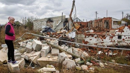 epa10260937 A local woman, Lara, shows her damaged private building at Cherkaski Tyshky village in ...