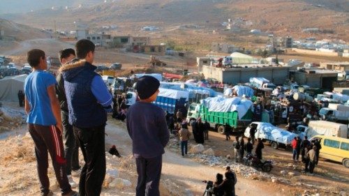 Syrians refugees prepare to leave Lebanon towards Syrian territory through the Wadi Hamid crossing ...