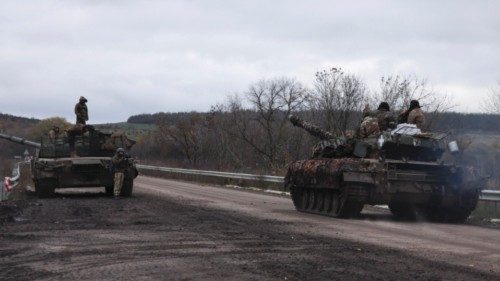 epa10269812 Seized Russian T-80 (left) and Ukrainian tanks on a road near the city of Bakhmut, ...
