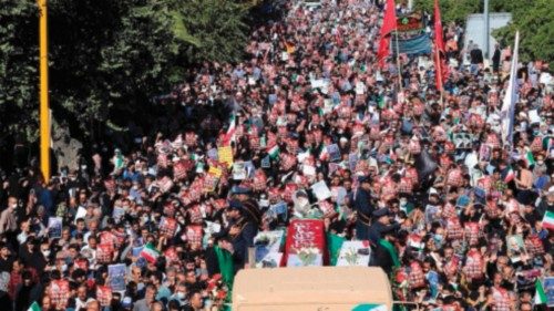 Mourners take part in a funeral for victims of a mass shooting at a key shrine earlier in the week ...