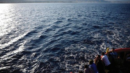 FILE PHOTO: Migrants are on deck before arriving at the port of Messina on board of Open Arms Uno ... FILE PHOTO: Migrants are on deck before arriving at the port of Messina on board of Open Arms Uno ...