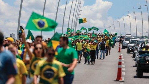 TOPSHOT - Supporters of Brazilian President Jair Bolsonaro march towards the barracks of the 63rd ...
