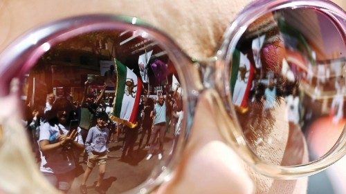 epaselect epa10287386 Protesters are reflected in a pair of sunglasses as they take part in a ... epaselect epa10287386 Protesters are reflected in a pair of sunglasses as they take part in a ...