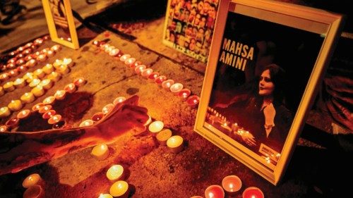 TOPSHOT - Iranian refugees and Iranians living in Greece lit candles forming the name 'Mahsa' during ...