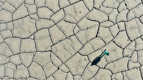 TOPSHOT - An aerial picture shows a man walking on the dried-up bottom of the Banja hydro-power ... TOPSHOT - An aerial picture shows a man walking on the dried-up bottom of the Banja hydro-power ...