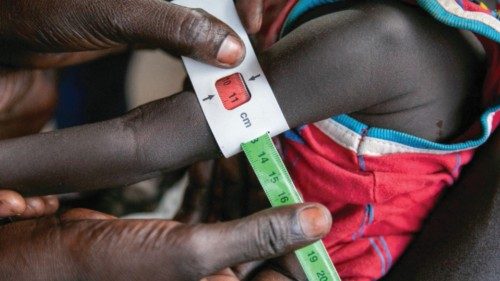 Regina Williams is screened for malnutrition at the Nyong Primary Health Care Unit (PHCU) nutrition ...