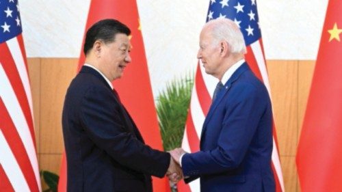 epaselect epa10305492 Chinese President Xi Jinping (L) greets his US counterpart Joe Biden before ...