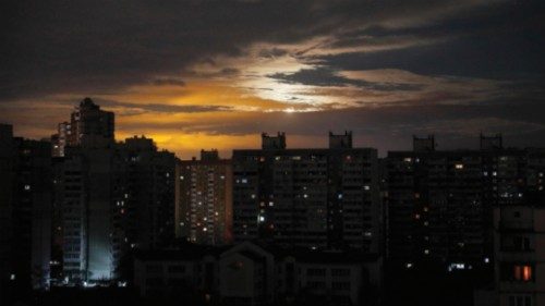 epaselect epa10300427 A view of the Moon shining through clouds behind a non-illuminated area of ...