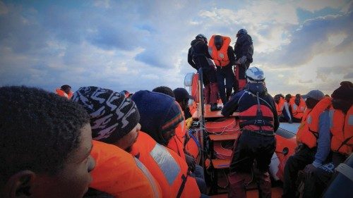 FILE PHOTO: Migrants wearing lifejackets are seen during a rescue operation by the MSF-SOS ...