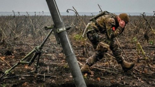A Ukrainian serviceman fires a mortar on a front line, as Russia's attack on Ukraine continues, in ...