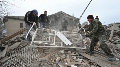Rescuers work at the site of a maternity ward of a hospital destroyed by a Russian missile attack, ...