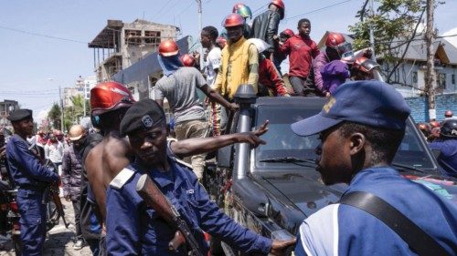 Congolese policemen maintain order during a civil society protest against the Luanda agreement, ...
