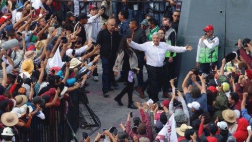 Mexican President Andres Manuel Lopez Obrador gestures to supporters as he attends a march in ...