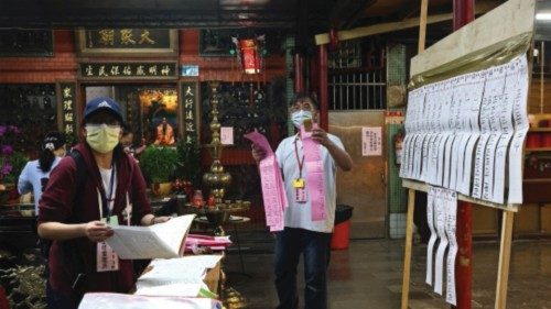 Electoral staff count local election votes at a temple in New Taipei City, Taiwan, November 26, ...