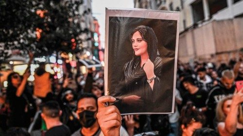 -- AFP PICTURES OF THE YEAR 2022 --A protester holds a portrait of Mahsa Amini  during a ...