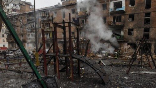 epa10323304 A destroyed children's playground as firefighters (rear) work at the site of an ...