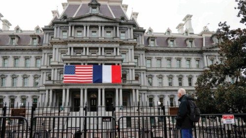 The French and US flags adorn the Eisenhower Executive Office Building next to the White House for ...