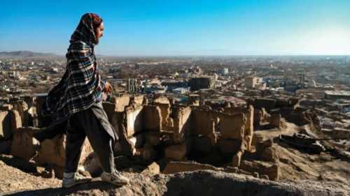 A Taliban security personnel stands guard atop an ancient fortress in Bala Hisar fort, in Ghazni ...