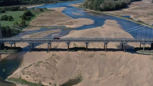 (FILES) This aerial file photo taken on September 20, 2022 shows a bridge over the dried out Loire ...