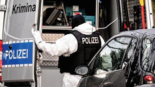 epa10353425 A police officer works during a raid in Berlin, Germany, 07 December 2022.?Twenty-five ...