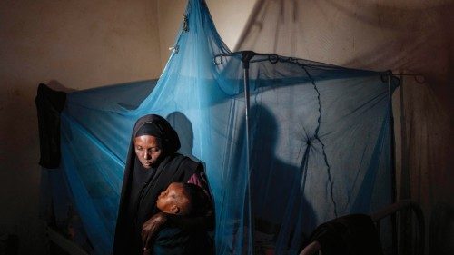 -- AFP PICTURES OF THE YEAR 2022 --Maimun Ali, 31, holds her 2-year-old child at Sahal Macalin ...