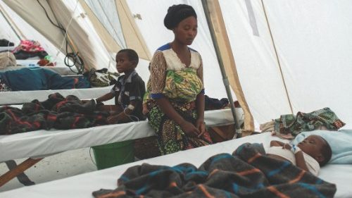 Namahigwe Christine, 30, looks after her children receiving cholera treatment at a new cholera ... Namahigwe Christine, 30, looks after her children receiving cholera treatment at a new cholera ...