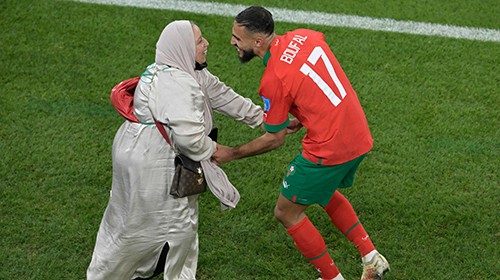 TOPSHOT - Morocco's midfielder #17 Sofiane Boufal celebrates with his mother after qualifying to the ... TOPSHOT - Morocco's midfielder #17 Sofiane Boufal celebrates with his mother after qualifying to the ...