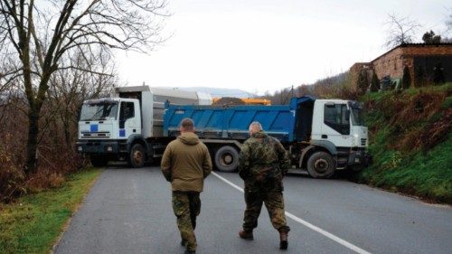 German officers serving in the peacekeeping mission in Kosovo (KFOR) inspect a road barricade set up ... German officers serving in the peacekeeping mission in Kosovo (KFOR) inspect a road barricade set up ...