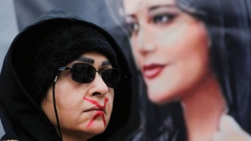 A woman takes part in a protest against the Islamic regime of Iran following the death of Mahsa ...