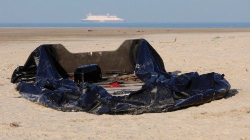 A damaged inflatable dinghy lies on the beach in Gravelines, one of the beaches used by migrants to ...
