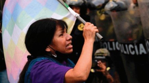 TOPSHOT - A supporters of former President Pedro Castillo confronts riot police during a protest ... TOPSHOT - A supporters of former President Pedro Castillo confronts riot police during a protest ...