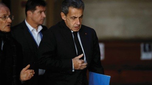 Former French President Nicolas Sarkozy arrives for his appeal trial on charges of corruption and ...