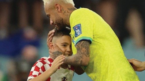 Brazil's forward #10 Neymar (C) is greeted by a Croatia supporter after his team lost the Qatar 2022 ...
