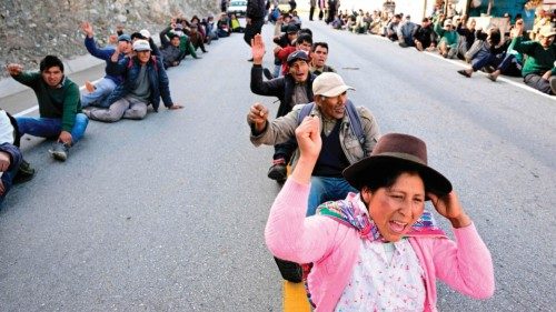 Peasants and leaders, supporters of former President Pedro Castillo, hold a blockade on a highway at ...