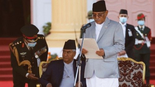 Nepal's newly elected Prime Minister Pushpa Kamal Dahal, also known as Prachanda (R), administers ...