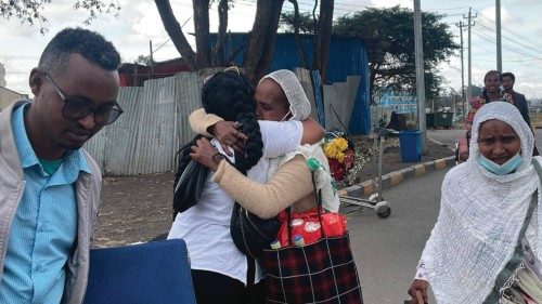 Passengers arriving from Tigray are greeted by relatives at the Bole International Airport in Addis ...