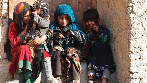 Children sit at the doorstep of a house along the street in Kabul on December 28, 2022. (Photo by ... Children sit at the doorstep of a house along the street in Kabul on December 28, 2022. (Photo by ...