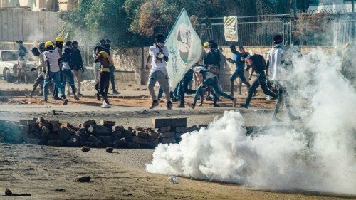 Tear gas is fired by Sudanese security forces in clashes with protesters during a demonstration ...