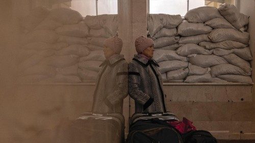epa10323843 Nina, who spent the whole time in Kherson during the Russian occupation, waits for her ...